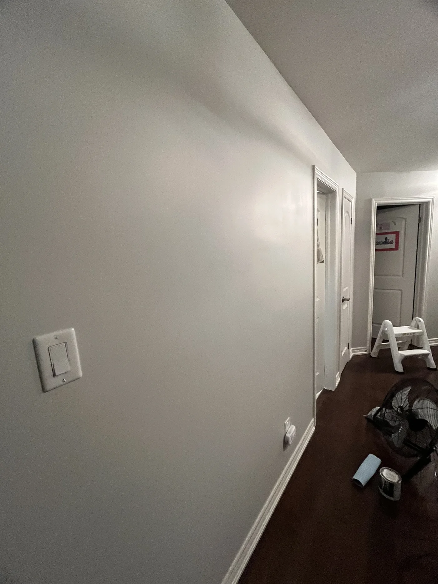 Hallway wall after drywall repair and paint