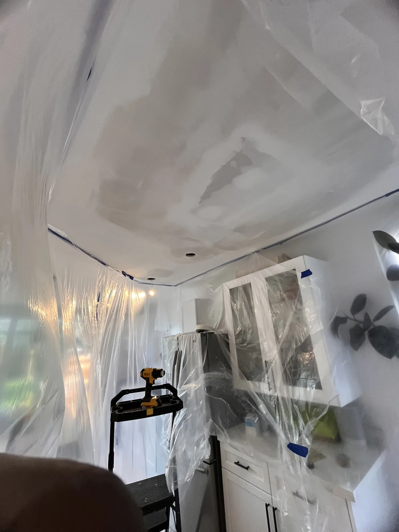 Kitchen ceiling drywall repair during first finishing coats