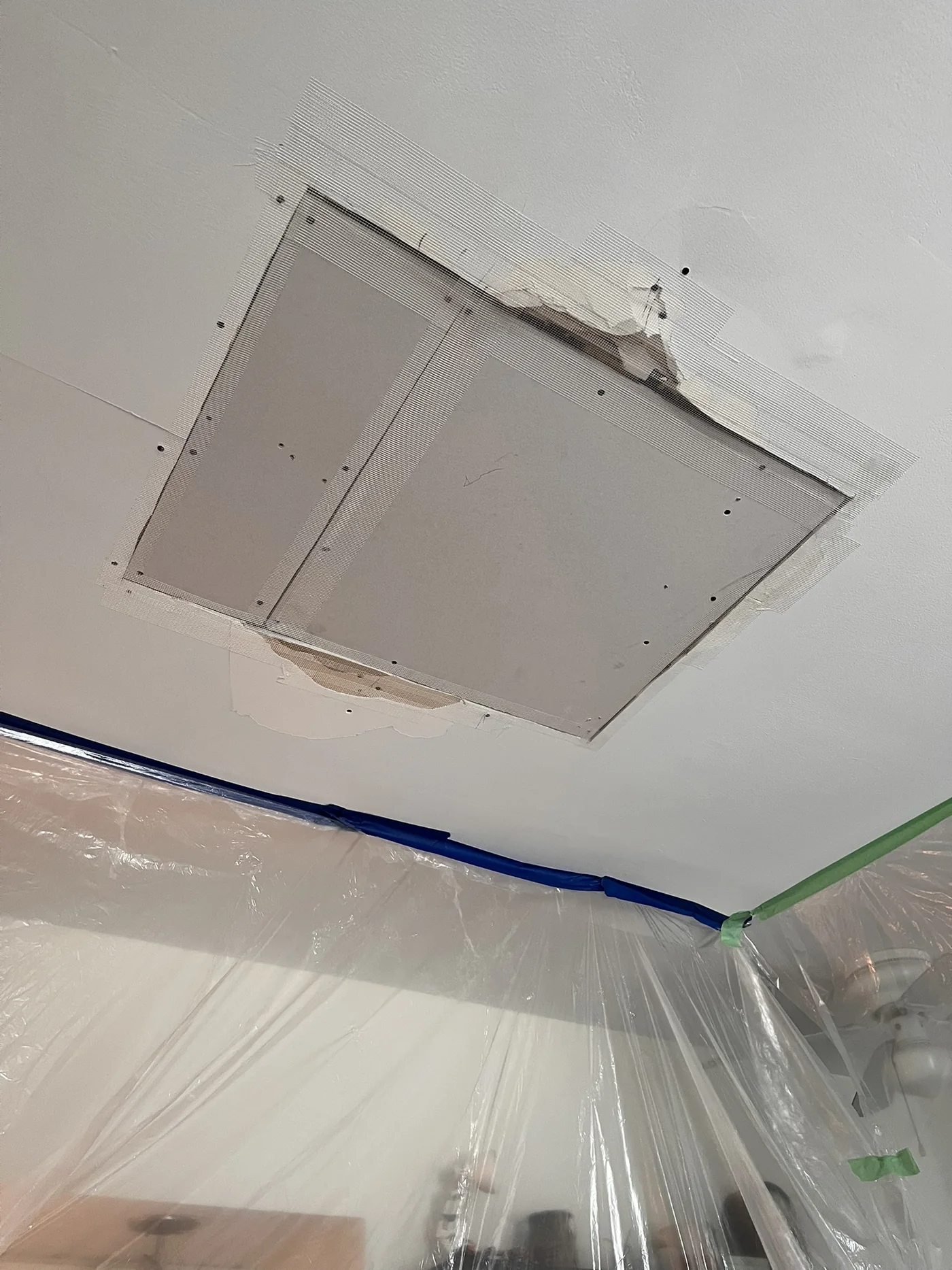 Ceiling repair seams reinforced with mesh